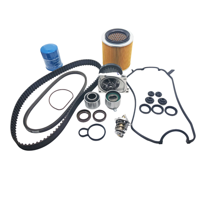 Complete 12-piece timing belt kit for 1992 Honda Acty Truck HA3, HA4 models , including timing belt, tensioner bearings, water pump, seals, thermostat, and oil filter, laid out on a white background.