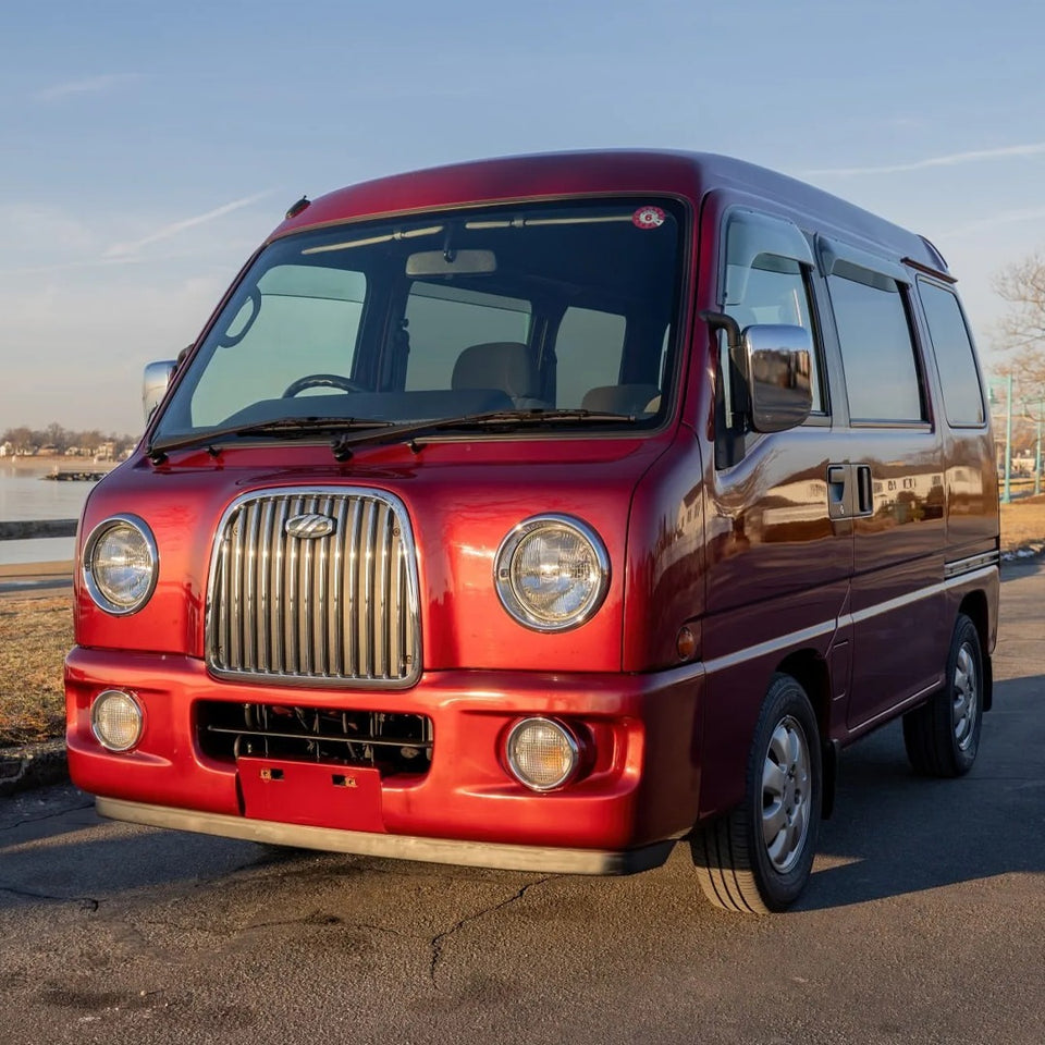 1999 Subaru Sambar TW2 Van in vibrant red with retro-style front grille, showcasing clean body lines and classic kei van design, ideal for parts and restoration.