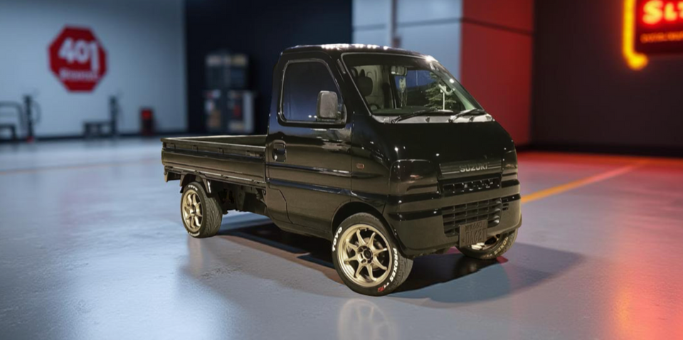 Customized Black Suzuki Carry Truck DA62T (2001-2003) with Performance Wheels, Sport Tires, and Sleek Appearance – Kei Truck Upgrades & Accessories