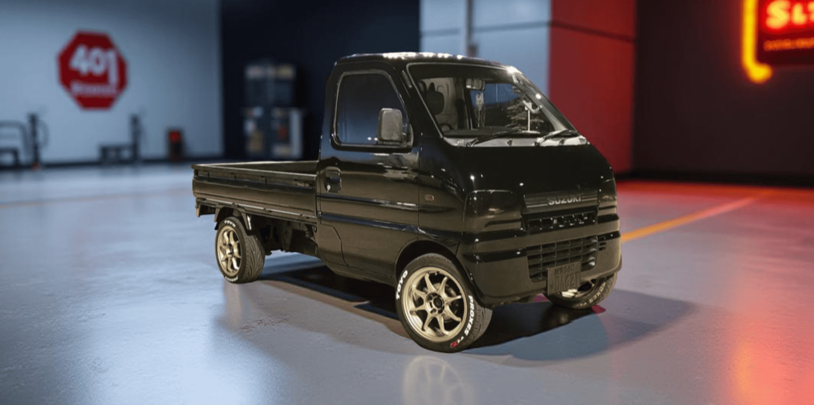 Customized Black Suzuki Carry Truck DA62T (2001-2003) with Performance Wheels, Sport Tires, and Sleek Appearance – Kei Truck Upgrades & Accessories