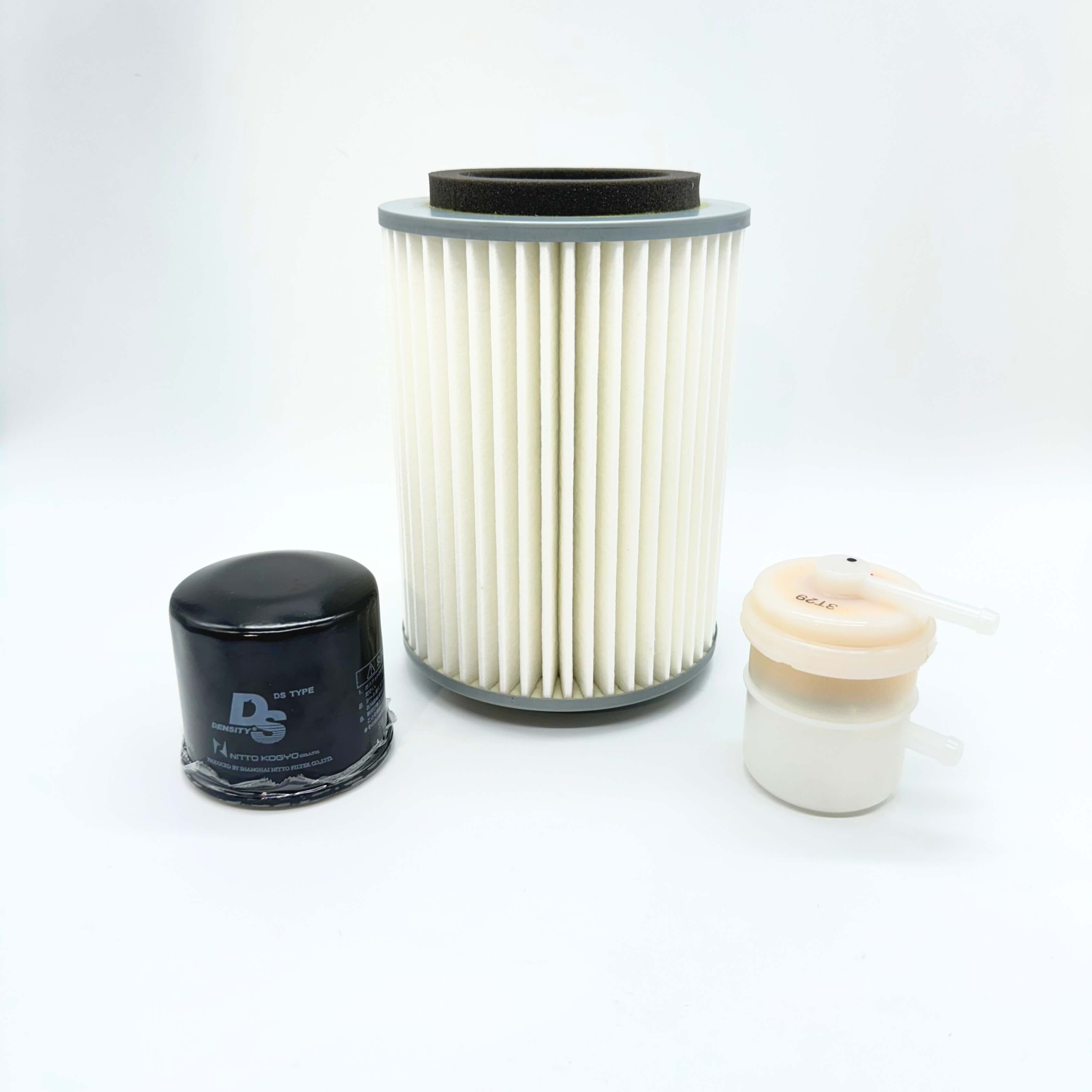 Suzuki Carry Truck DC51T, DD51T (1991-1998) maintenance filter kit featuring pleated engine air filter element, black spin-on oil filter cartridge, and inline plastic fuel filter strainer – Filter Collection.