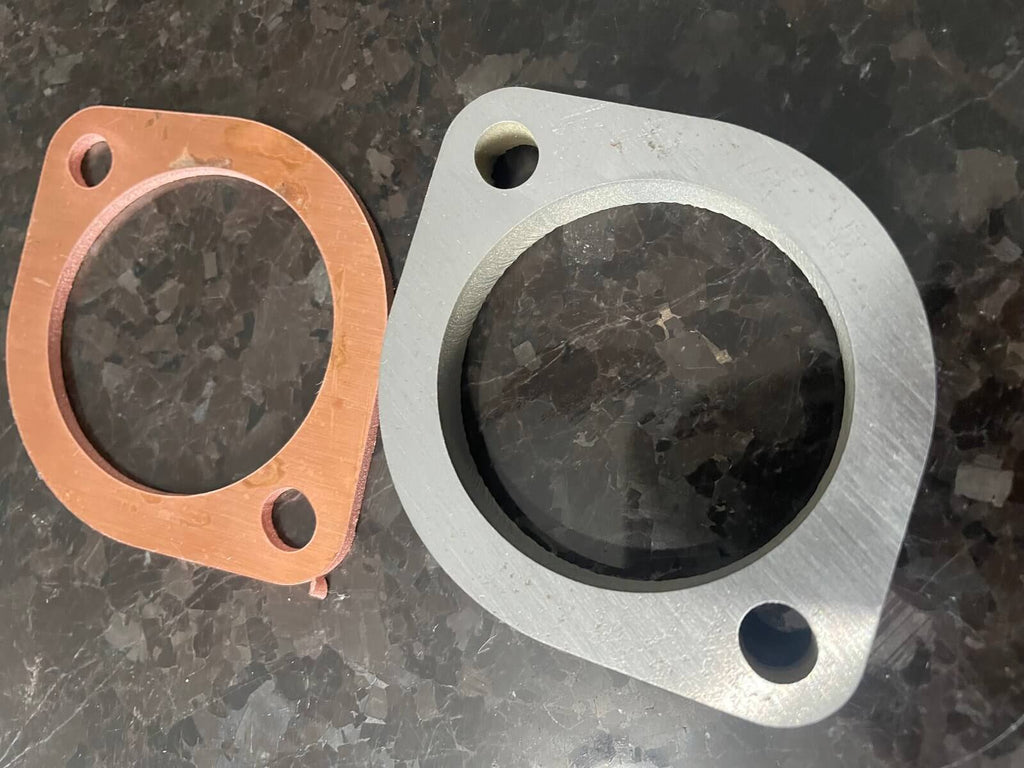 Honda Acty 1990-1999 exhaust upgrade with waterjet cut flange in mild steel next to optional copper gasket for bolt-on installation efficiency.