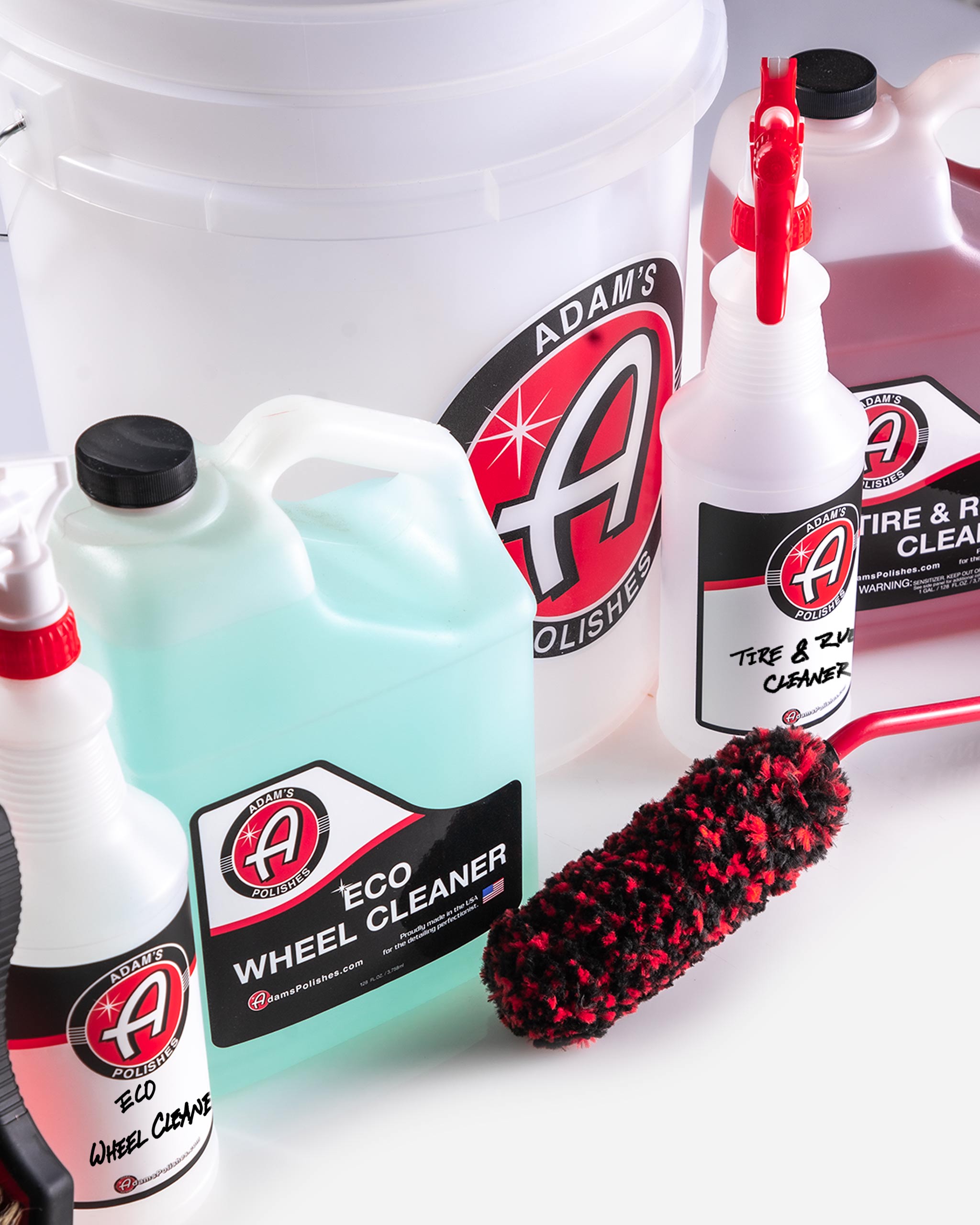 Complete Adam’s Polishes Best Wheel Cleaner kit with Eco Wheel Cleaner, Tire & Rubber Cleaner, a 5-gallon bucket, and specialized wheel brushes, ideal for maintaining delicate wheel finishes without scratching or damage.