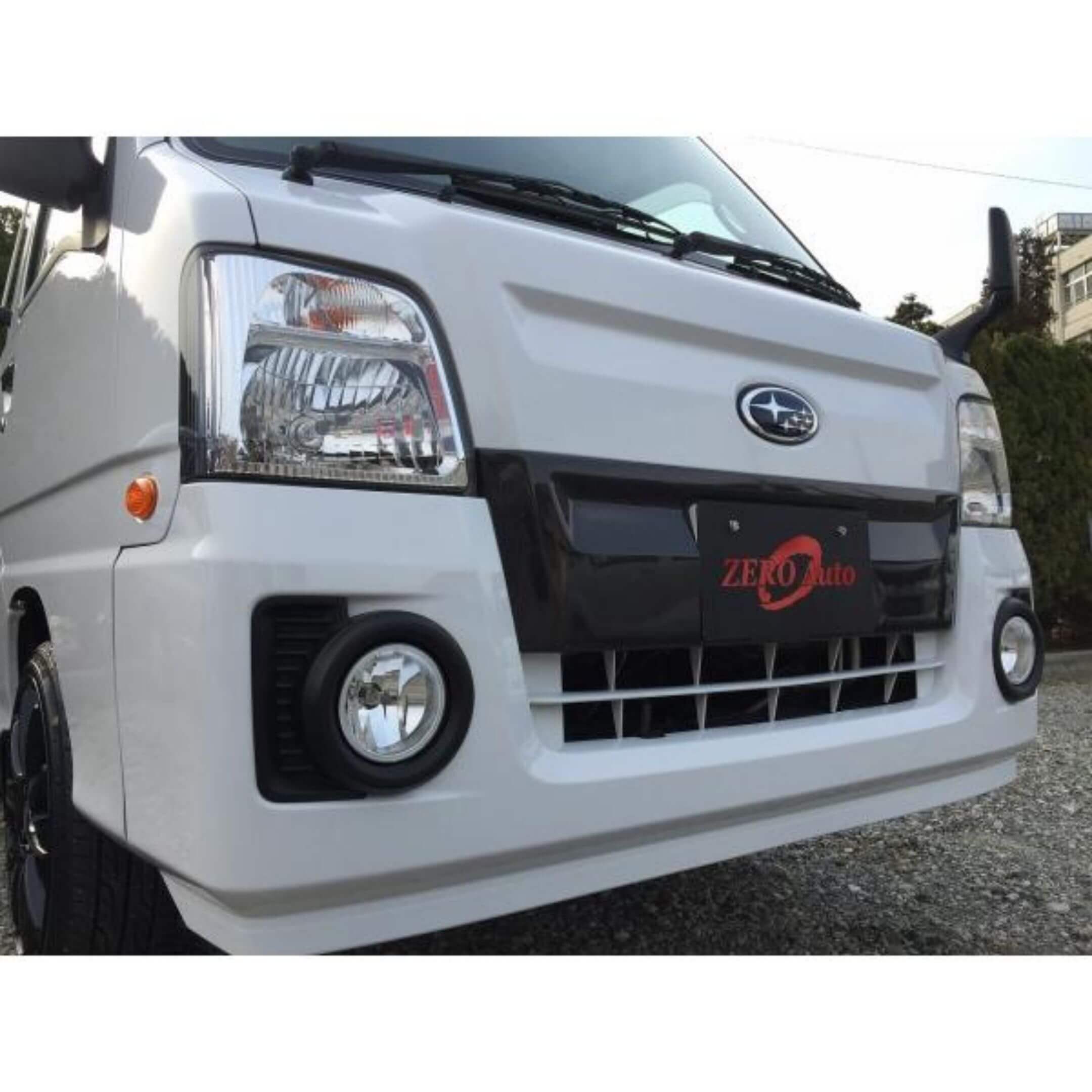 Front Bumper Carbon Fiber Cover by Zero Auto for Subaru Sambar Truck TT1, TT2 Models (2009-2012) featuring sleek design and durable construction.