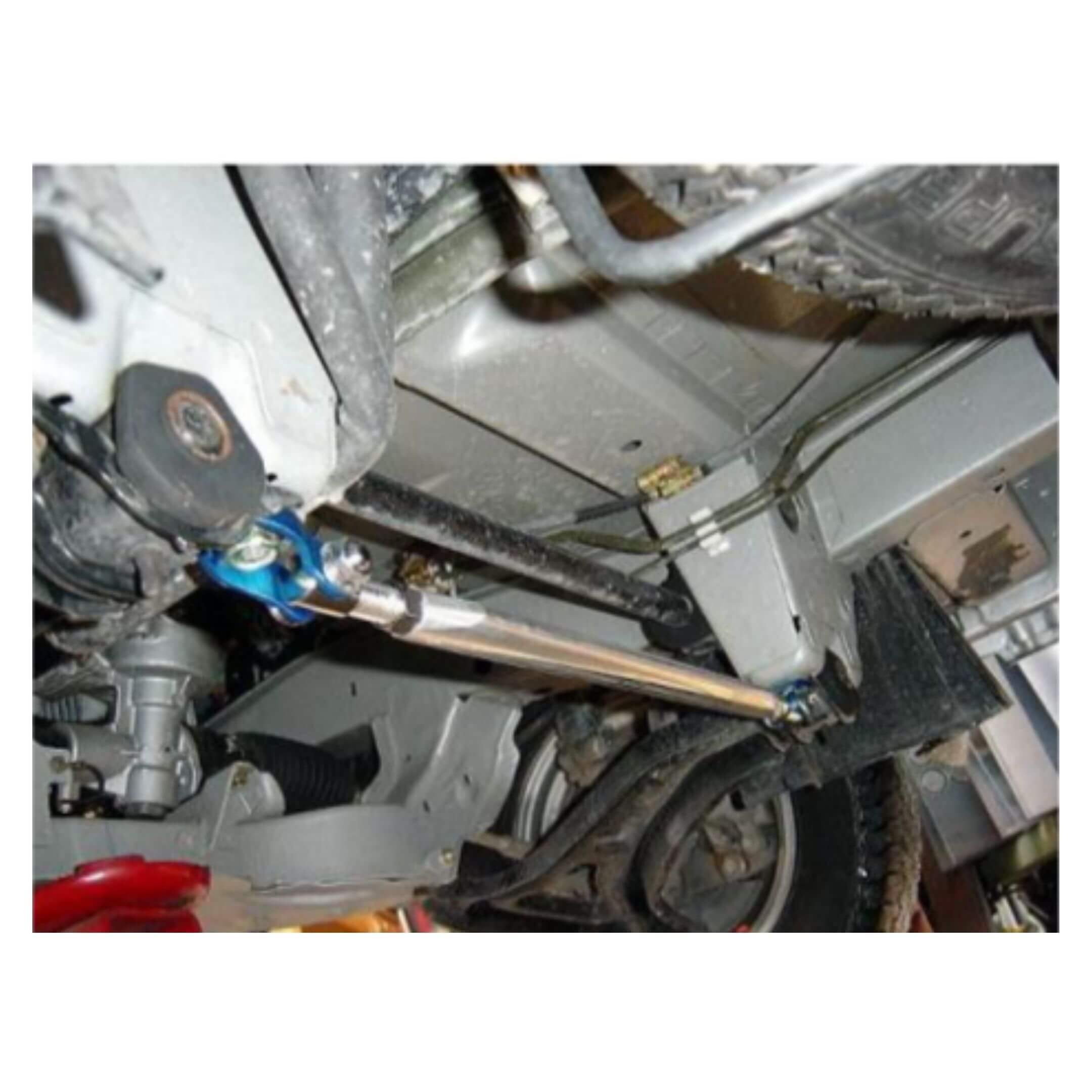 Front Lower Arm Bar by Kawai Manufacturing for Honda Acty Truck HA6, HA7 models (1999-2009) featuring a sleek metallic finish and robust construction.