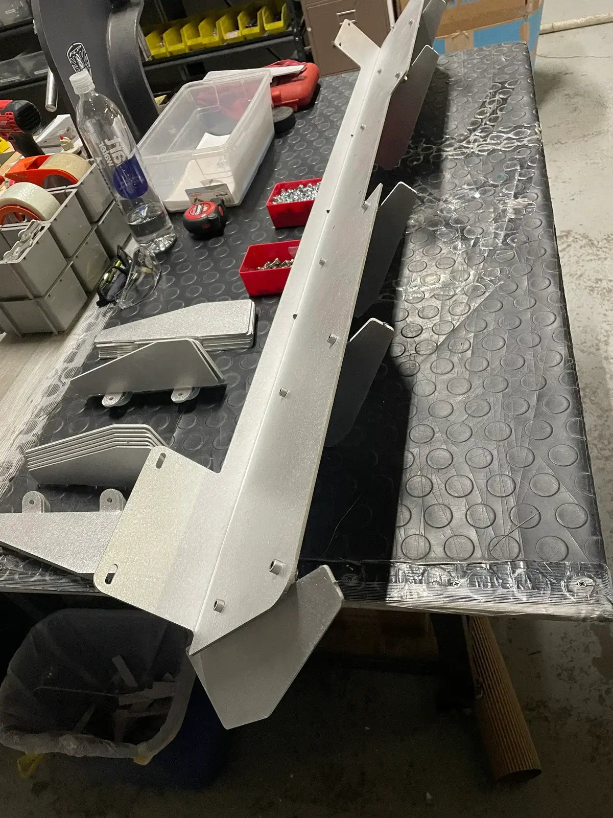 Rear diffuser for Honda Acty Truck HA3, HA4 models, 1990-1999, silver aluminum, displayed on a textured black surface