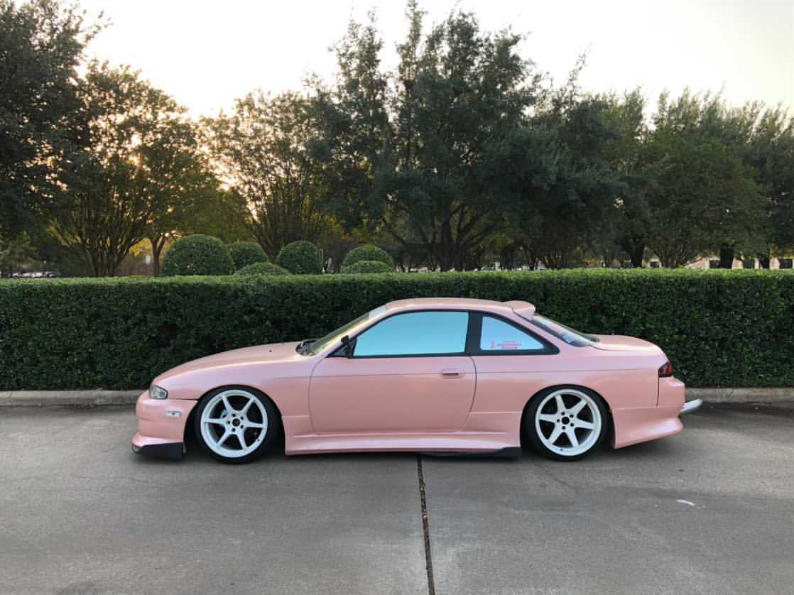 Pink Nissan Silvia coupe equipped with Omnique's Neo Silver tint, offering a chic and reflective appearance.