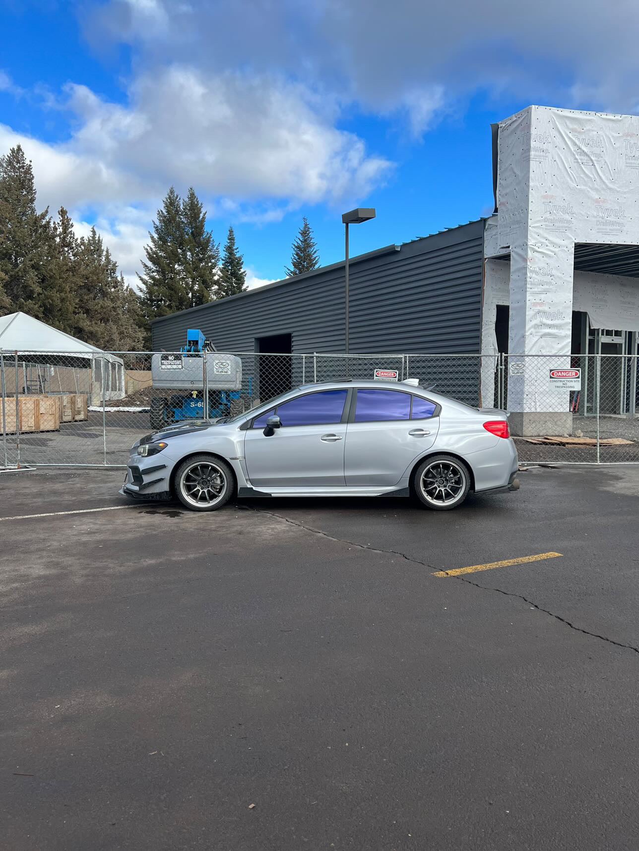 Silver Sedan with Omnique Amethyst Purple Tint – Stylish Omnique reflective purple tint on a silver sedan, providing privacy and UV protection.