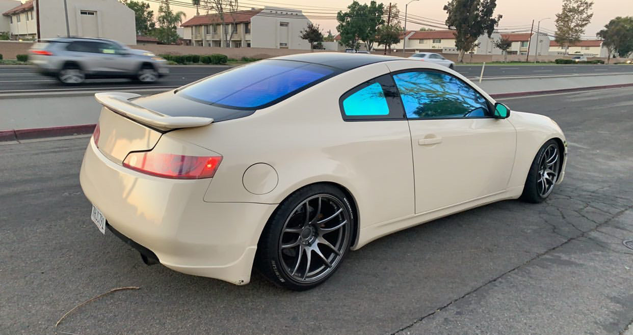 Omnique Opal ceramic tint applied to a coupe, showcasing blue and purple hues with a vibrant colorshift.