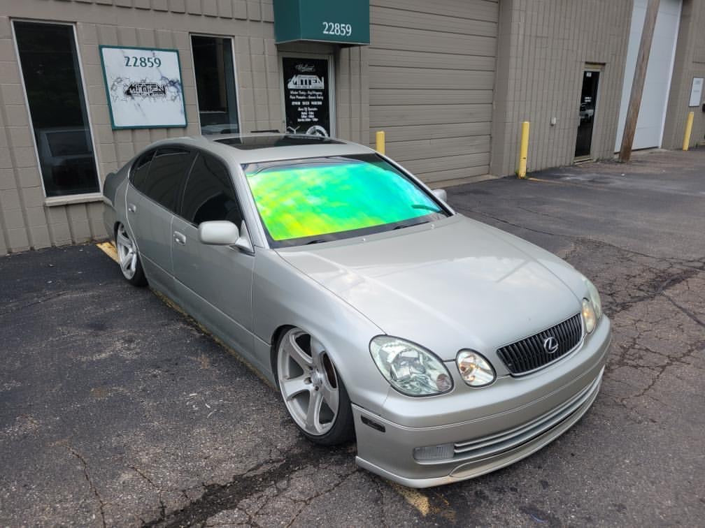 Lexus Sedan with Omnique Aurora Colorshift Windshield Tint - Vibrant Yellow and Green Shift.