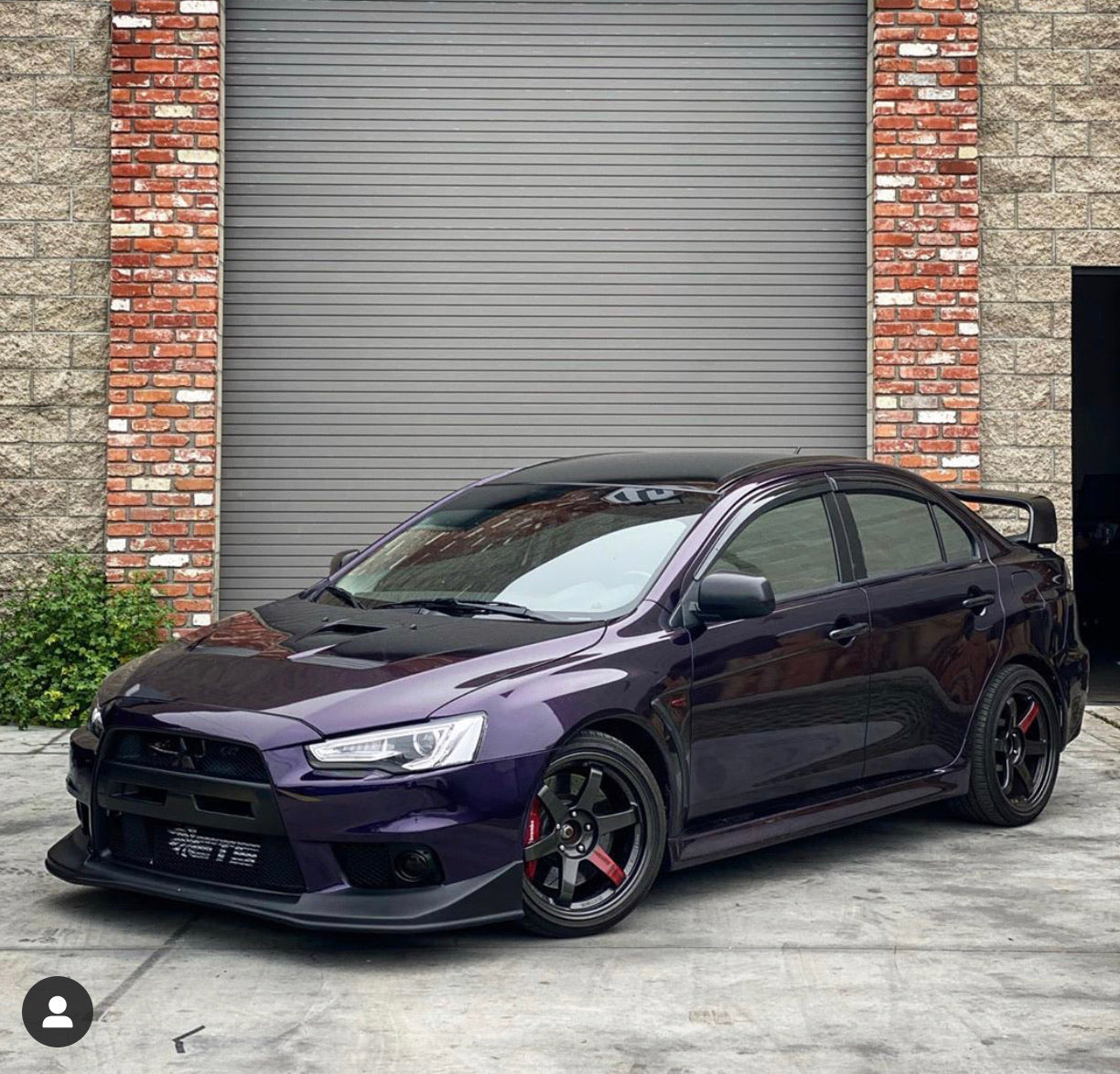 Purple Mitsubishi Lancer with Nebula Black tint applied, offering a sleek mirror-like look.