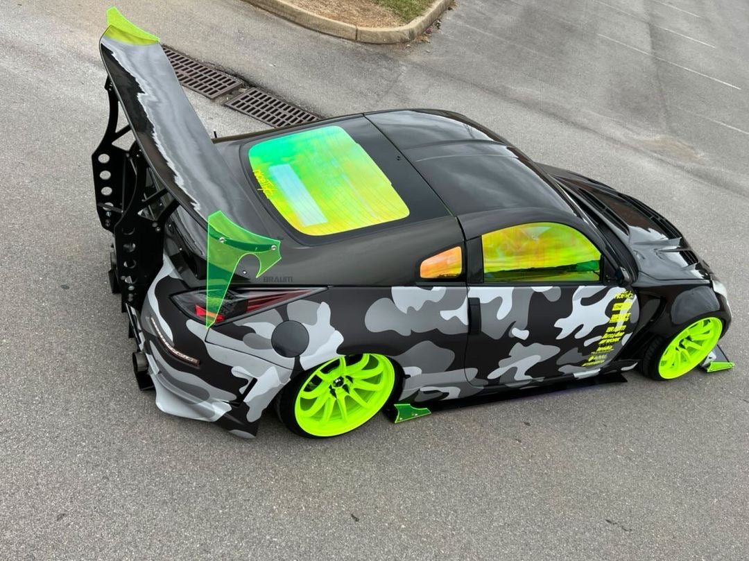 Custom Vehicle with Omnique Aurora Colorshift Tint and Green Accents - High-Performance Look.