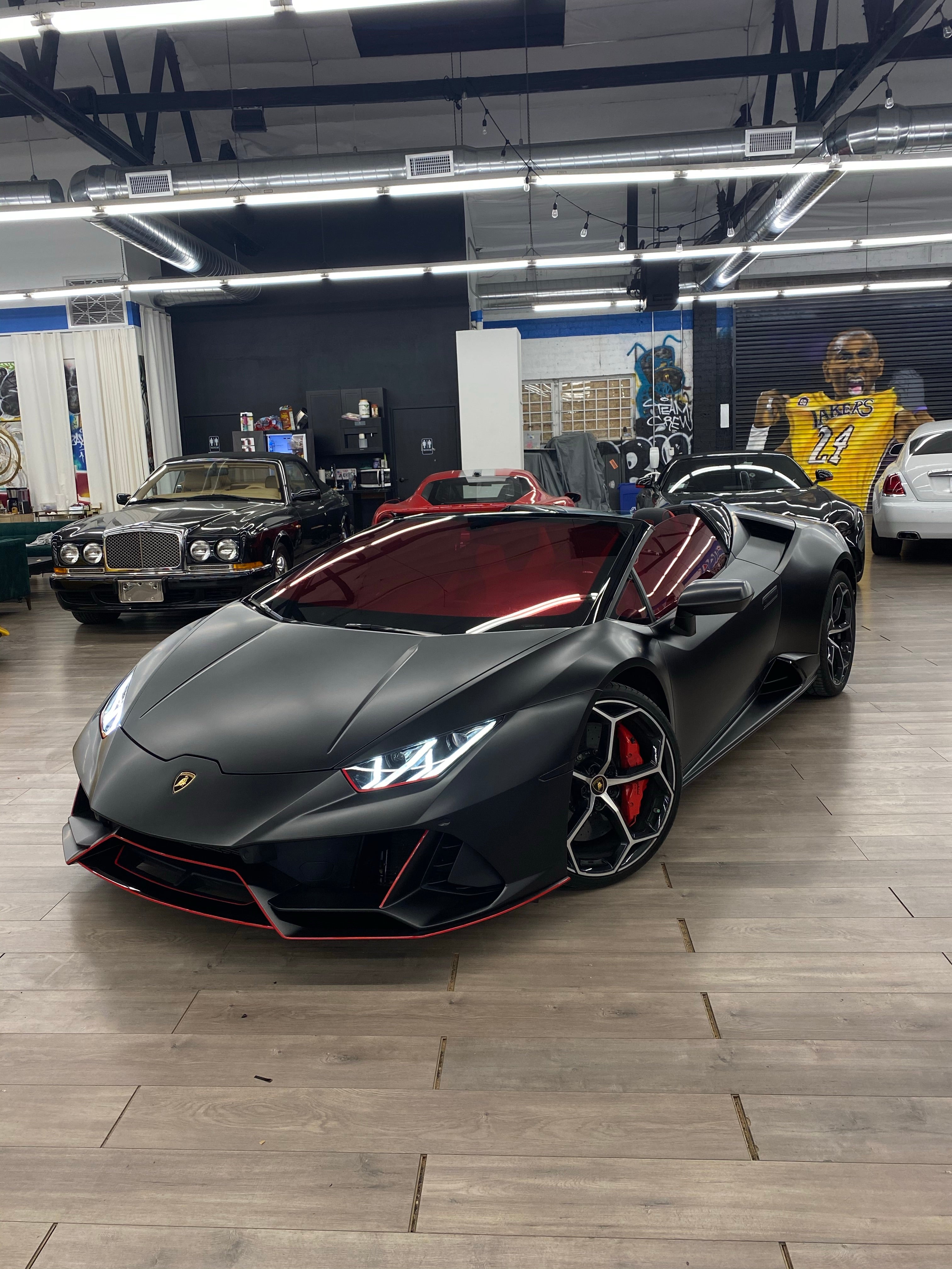 Custom yellow sports car with Omnique Vulcan Red tint, creating a mirror-like red finish.