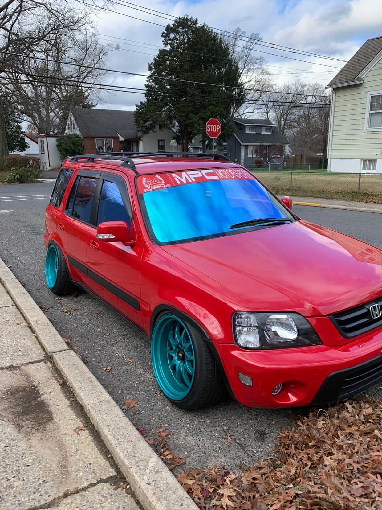 Honda CRV with Omnique Opal tint, providing a mix of blue and green colors reflecting off the windows.