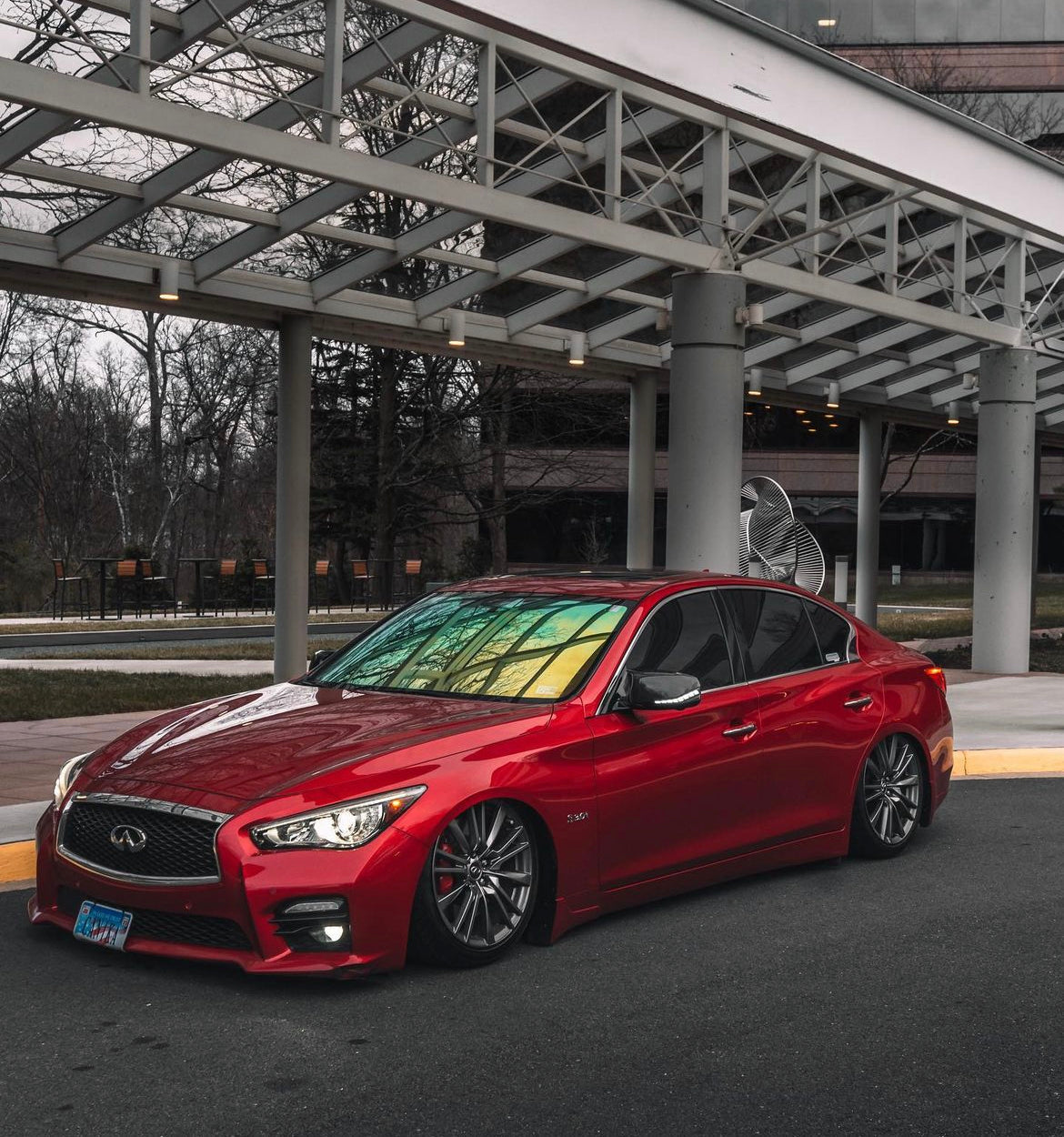 Infiniti Q50 with Omnique Aurora Colorshift Tint - Vivid Yellow-Green Colorshift on Front Windshield.