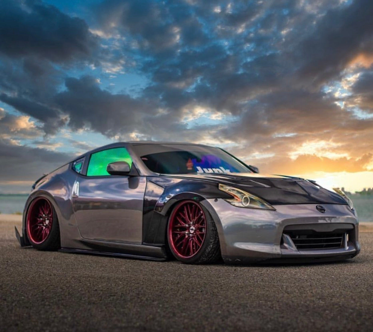 Nissan 370Z with Omnique Aurora Colorshift Tint - Multi-Color Reflection Under Sunset.