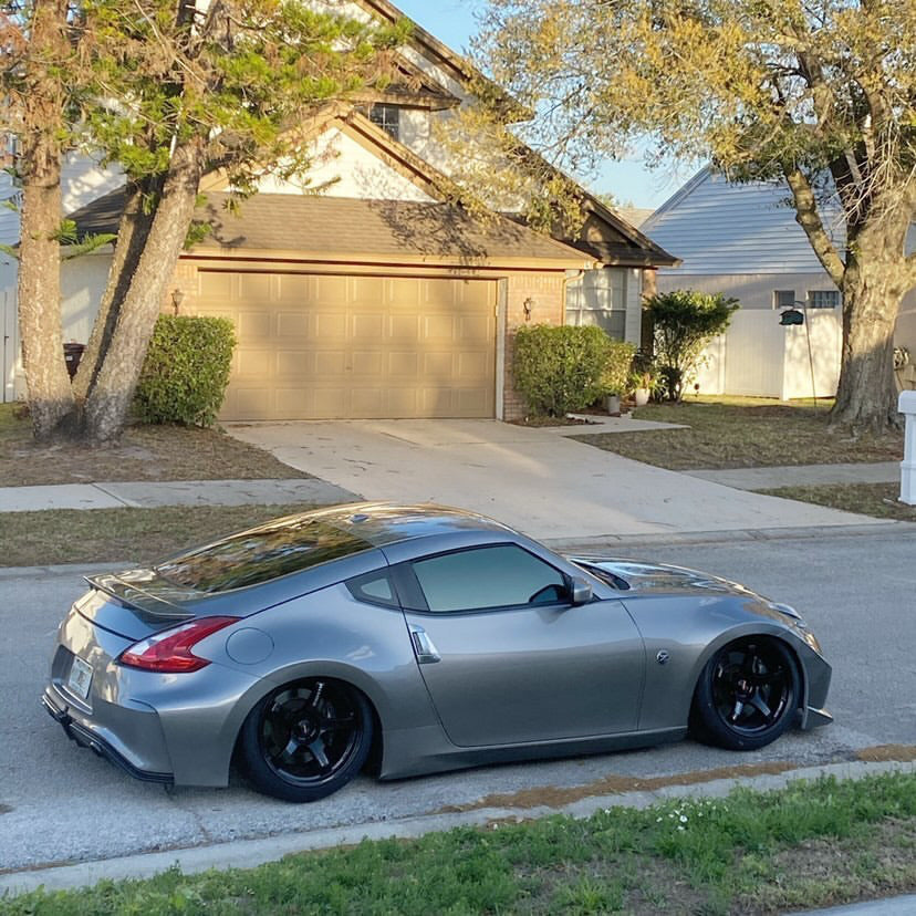 Nissan 370Z with Nebula Black tint, delivering a high-end, reflective black finish.