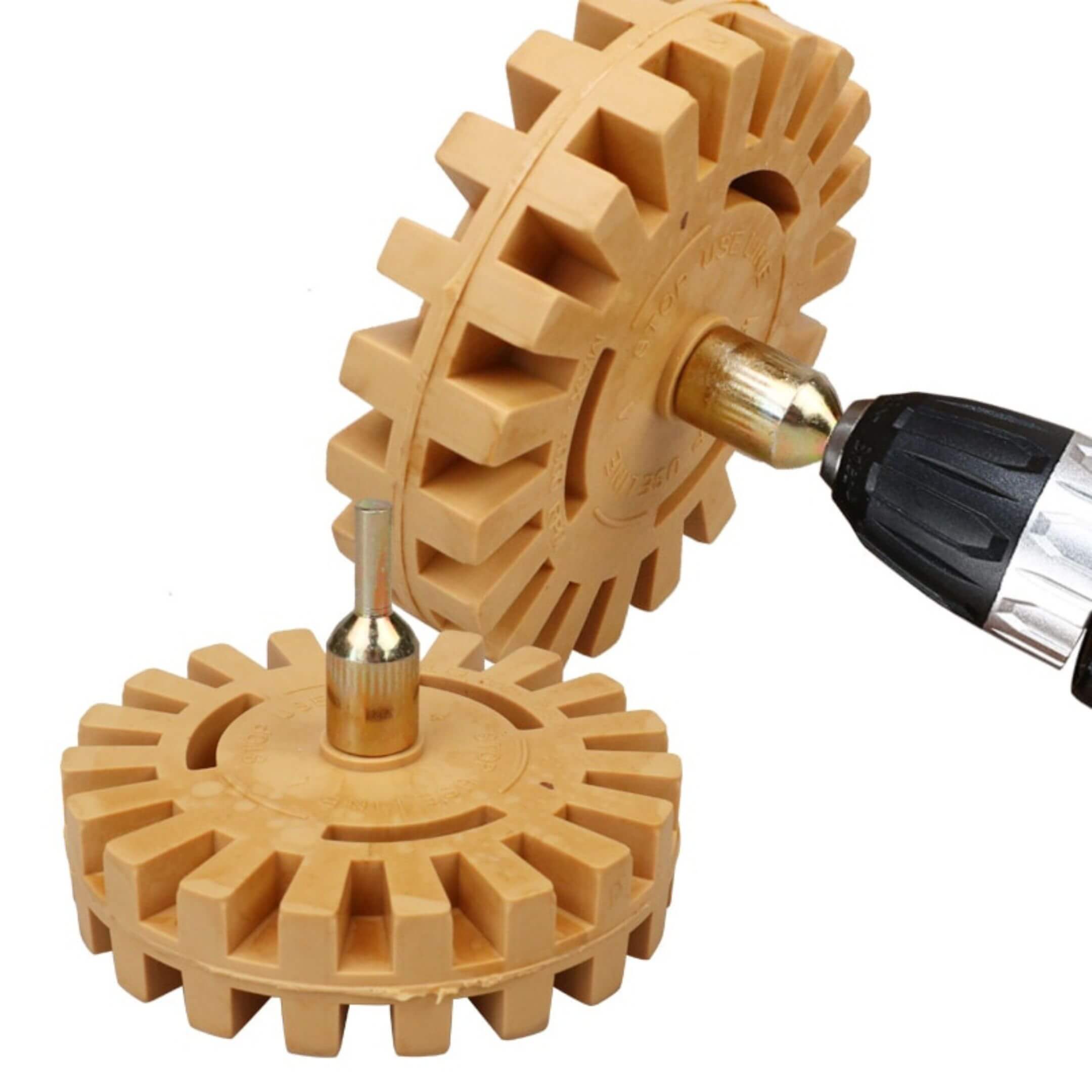 Rubber decal eraser wheel on drill removing old Honda Acty vinyl—4in paint-safe adhesive remover.