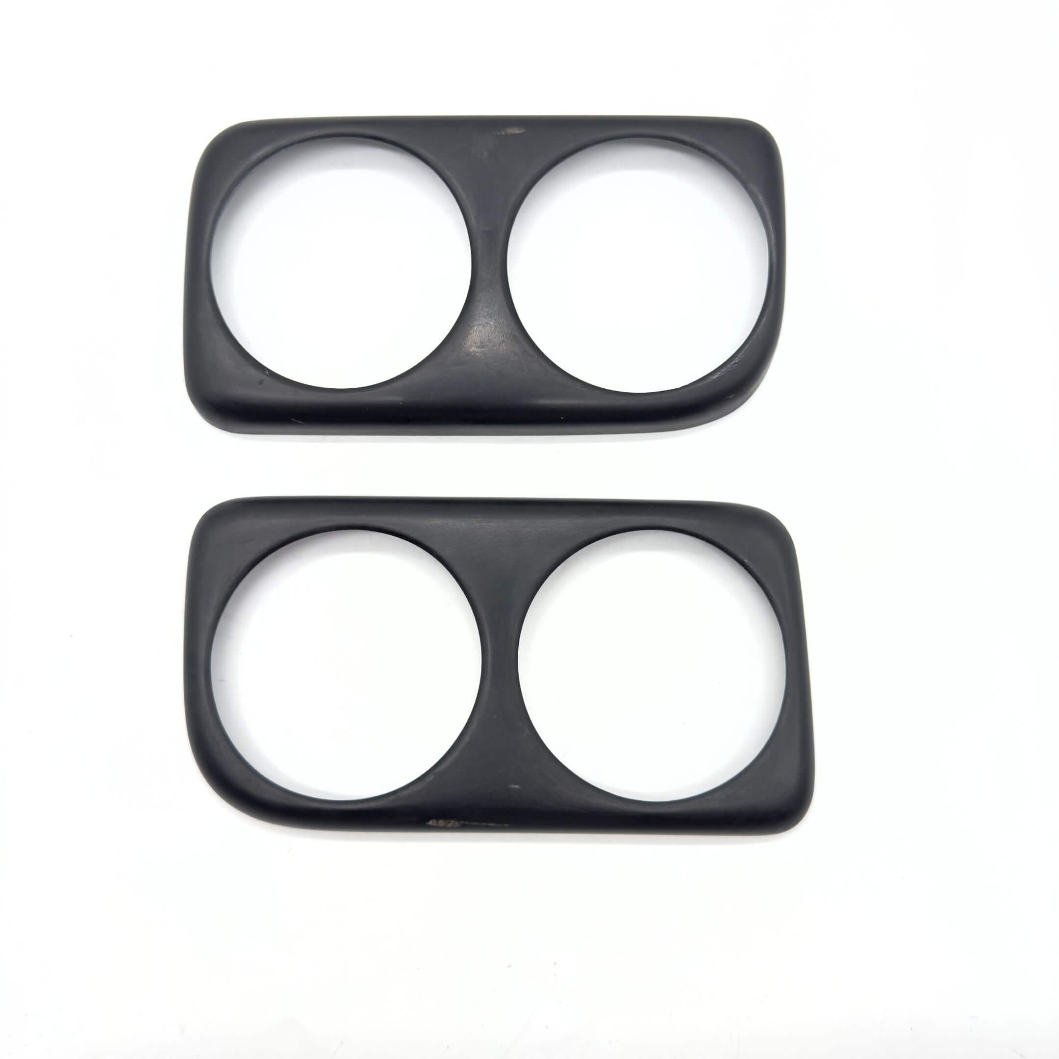 Fiberglass Taillight Garnish Cover in racing style for Subaru Sambar Truck TT1, TT2 models (1999-2012) featuring a sleek black finish with dual circular cutouts.