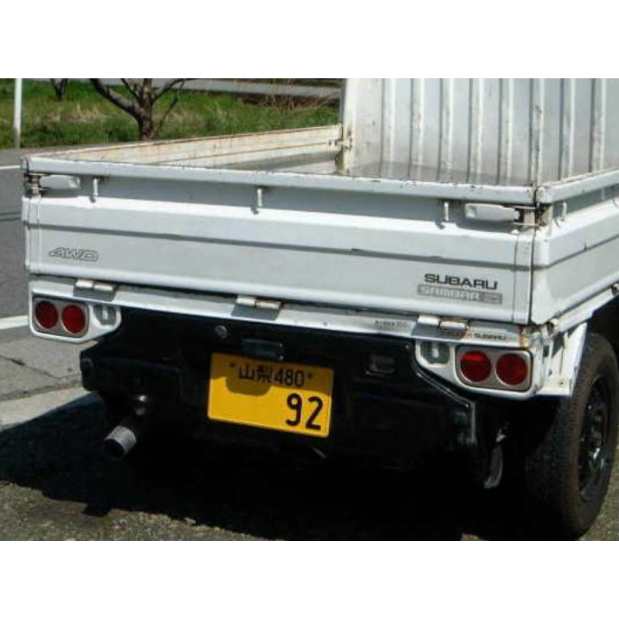 Fiberglass Taillight Garnish Cover in Racing Style for Subaru Sambar Truck TT1, TT2 Models (1999-2012) featuring a sleek rear design.