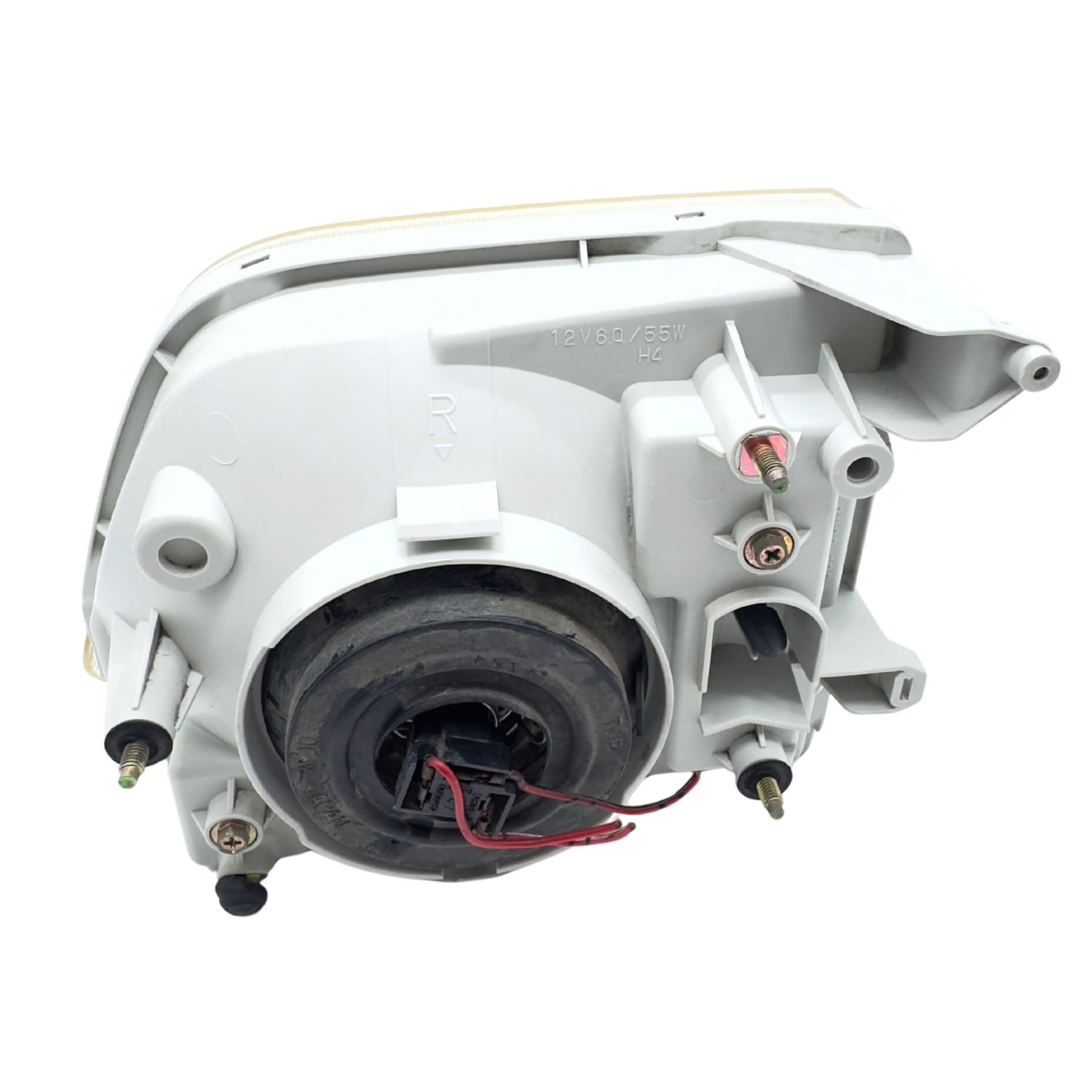 Used right driver side headlight for Subaru Sambar Truck TT1, TT2 models (2002-2012) featuring wiring and mounting components.