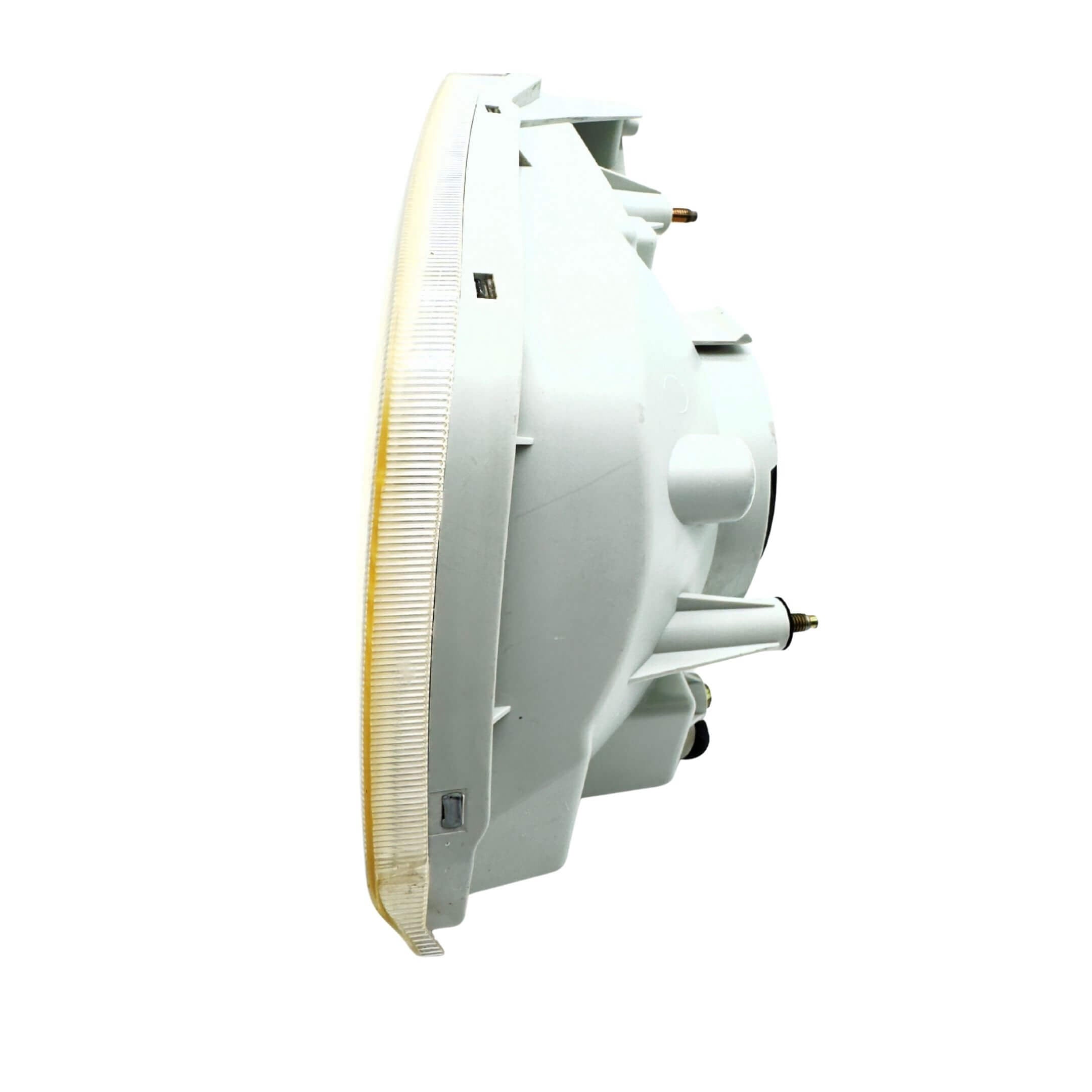 Used right driver side headlight for Subaru Sambar Truck TT1, TT2 models (2002-2012) featuring a clear lens and mounting points.