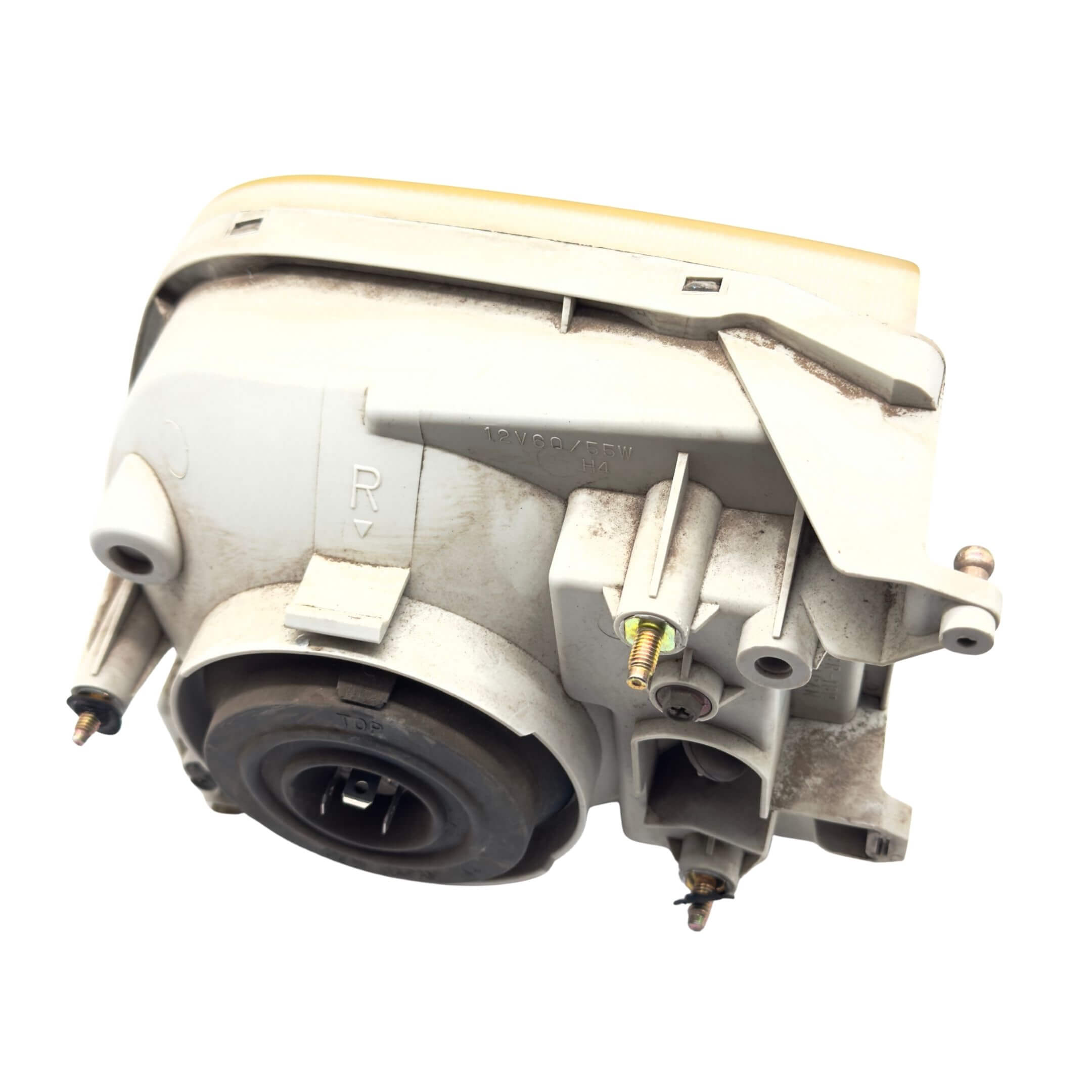 Used left passenger side headlight for Subaru Sambar Truck TT1, TT2 models (2002-2012) featuring mounting brackets and bulb socket.