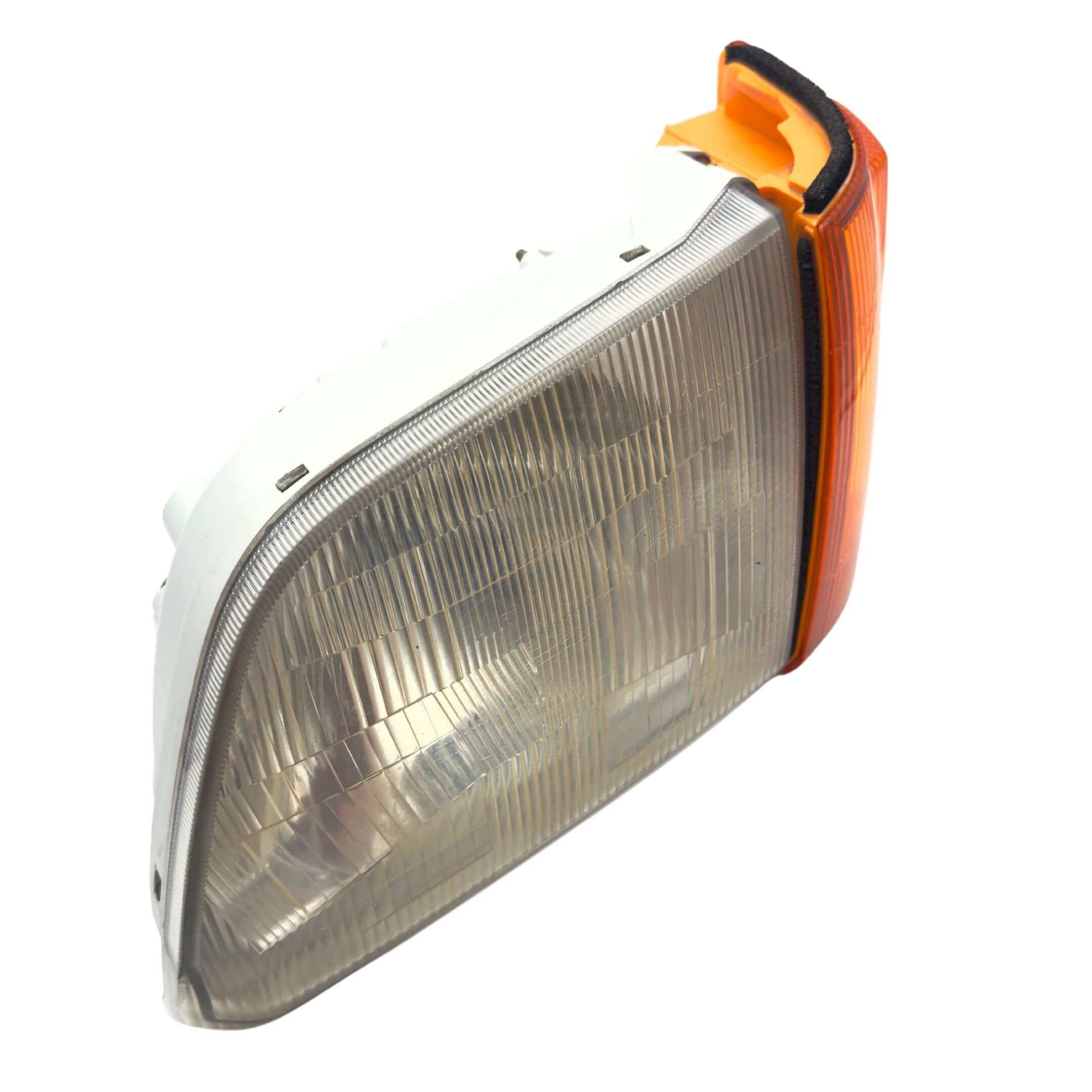 Headlight and Turn Signal Assembly for Subaru Sambar Wagon TW1, TW2 Models (1999-2012) featuring a clear lens and amber turn signal.