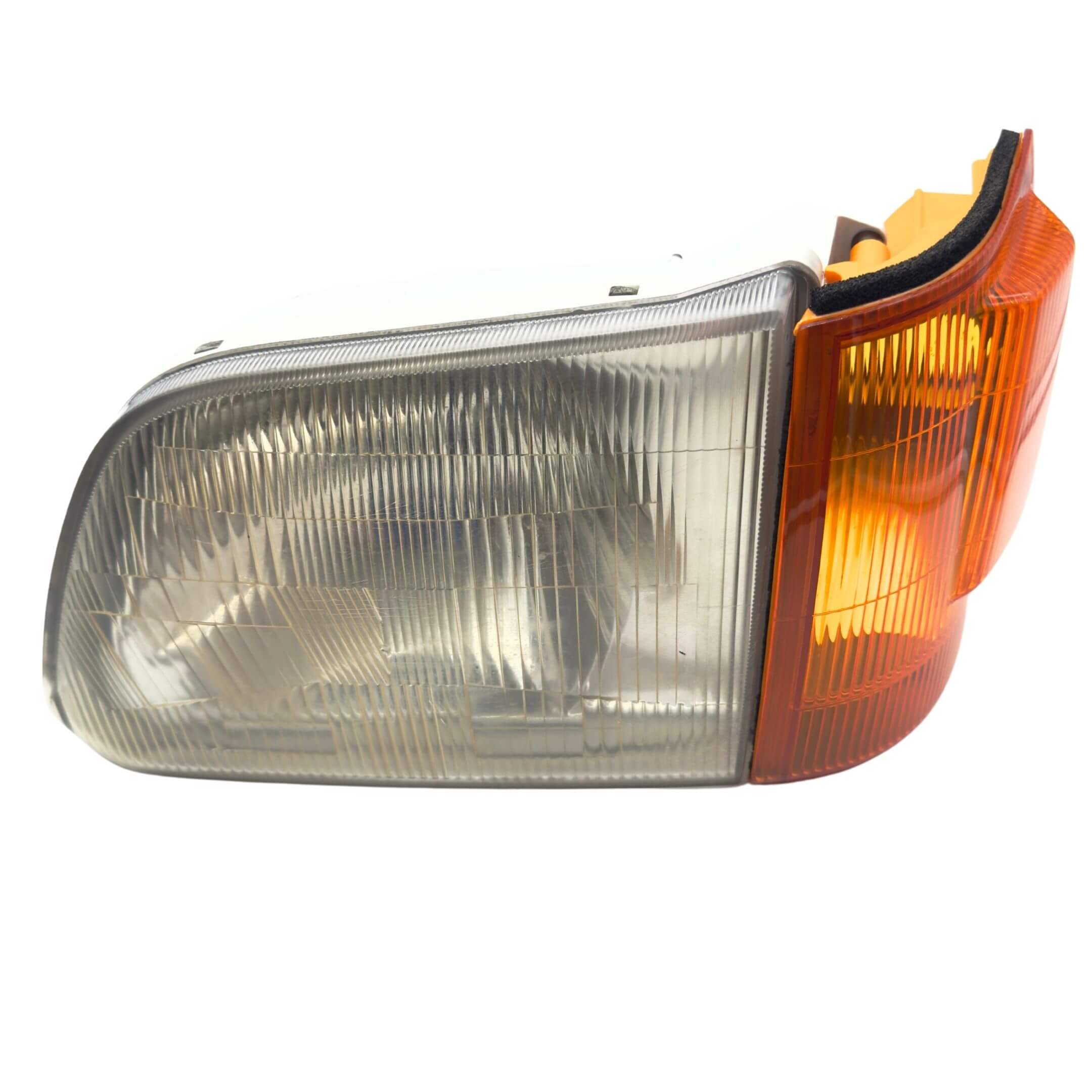 Headlight and Turn Signal Assembly for Subaru Sambar Van TV1, TV2 Models (1999-2012) featuring a clear lens and amber reflector.