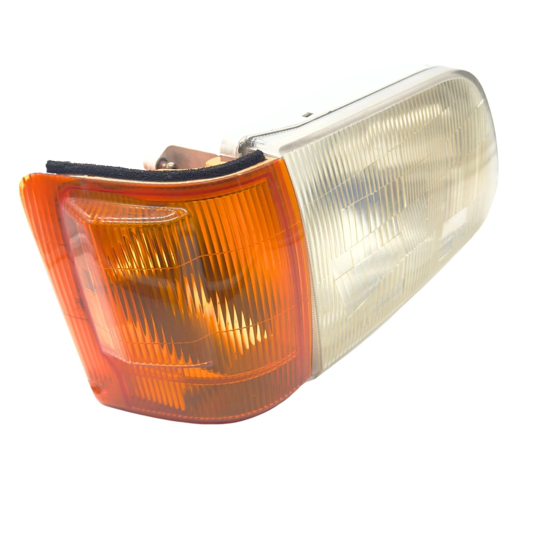 Headlight and Turn Signal Assembly for Subaru Sambar Wagon TW1, TW2 Models (1999-2012), featuring a clear lens with an amber section on the right driver side.