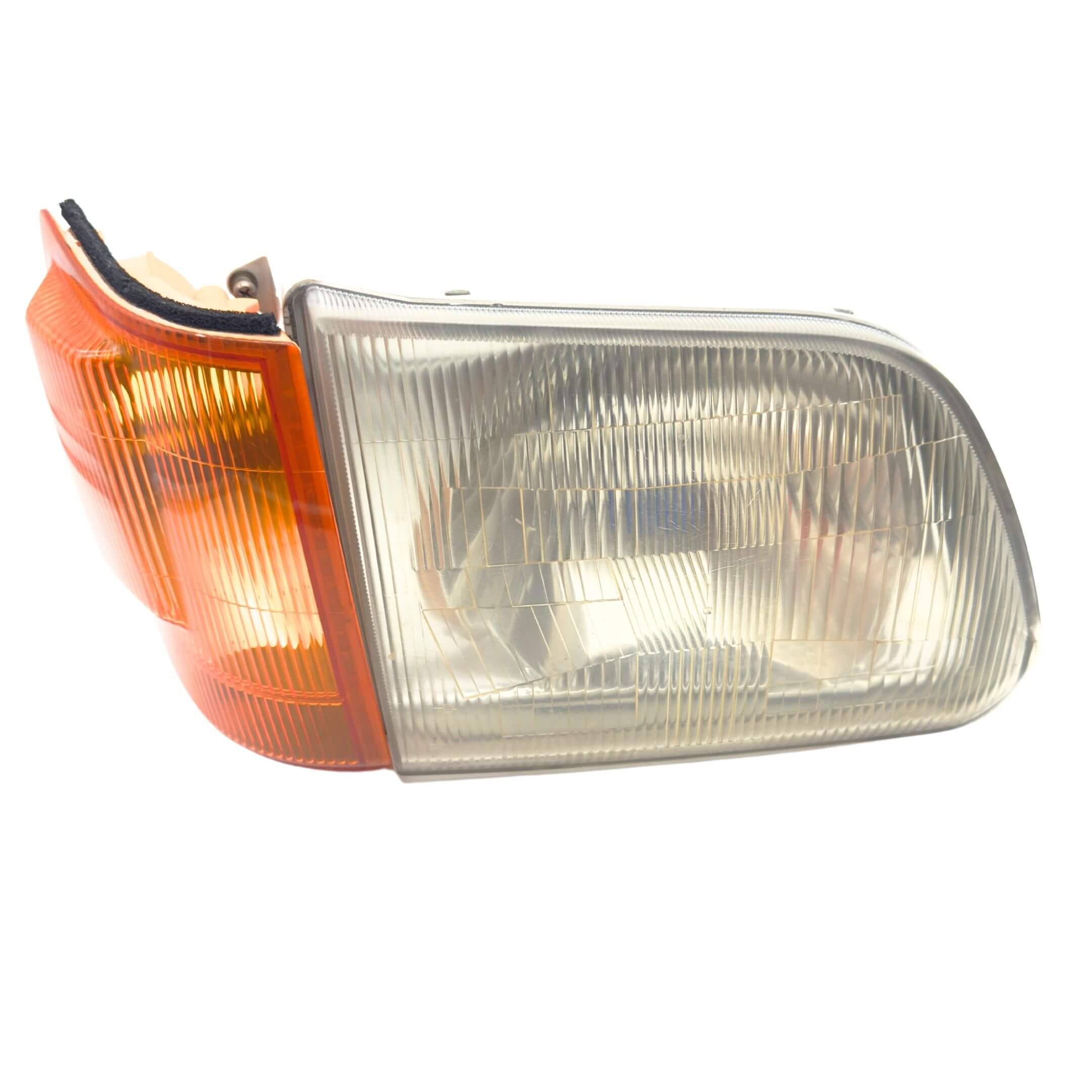 Headlight and turn signal assembly for right/driver side of Subaru Sambar Truck TT1, TT2 models (1999-2012), featuring a clear lens and amber reflector.