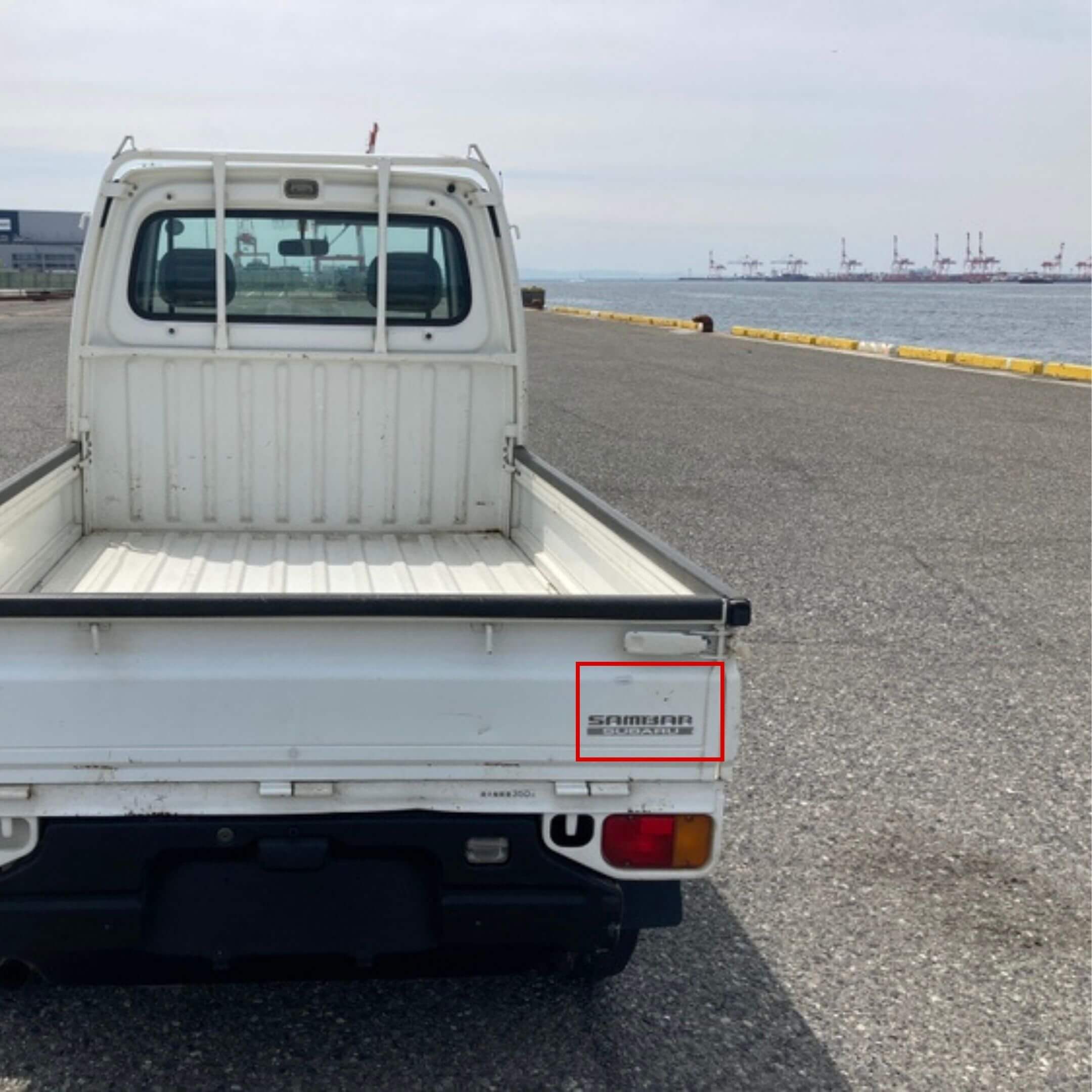 Sambar Subaru Decal for Rear Tailgate on Subaru Sambar Truck TT1, TT2 Models (1999-2012) with visible branding on white tailgate.