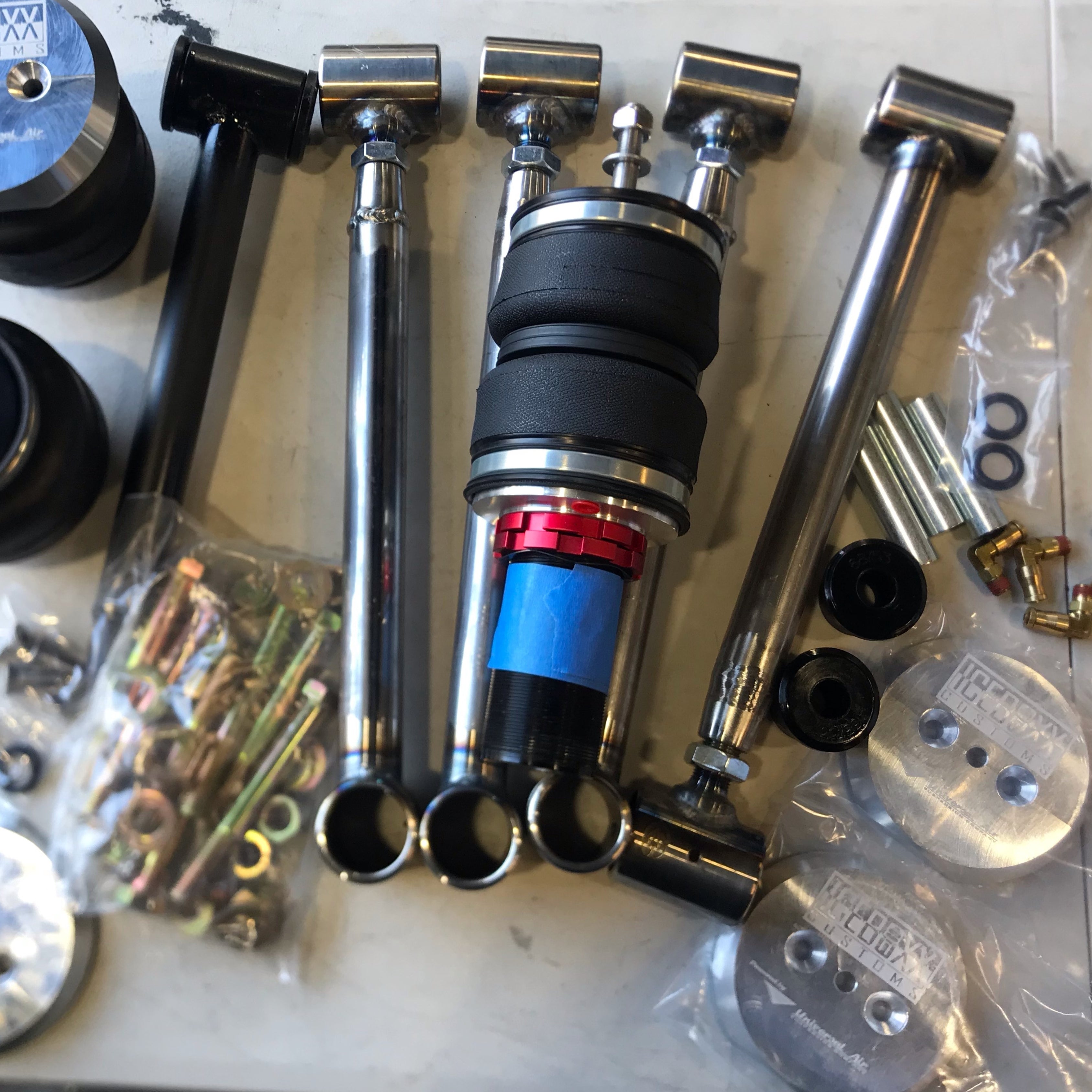 Honda Acty's air suspension parts laid out, showcasing the quality and components included in the air ride kit for HA3/HA4 models